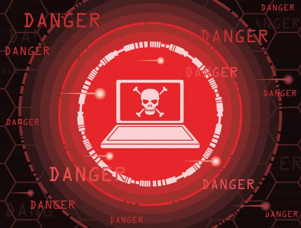 ilustração que mostra um computador com uma caveira no centro, para simular o perigo de vírus de computador